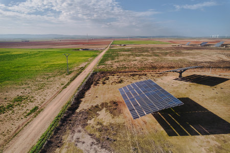 Aerial photograph of rural area near Zaragoza, Spain, showcasing renewable energy landscape with large solar panels efficiently converting sunlight into electricity.の写真素材