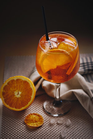 Close up of Aperol Spritz cocktail beautifully served in glass with ice cubes and orange slicesの写真素材