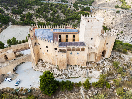Stunning drone view of Castillo de Velez-Blanco Renaissance castle perched on rocky hill in Andalusia, Spain, surrounded by rolling hills. Medieval and Moorish heritage conceptの写真素材
