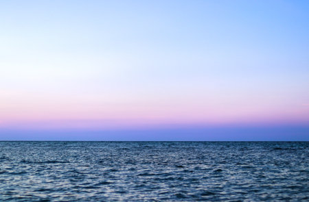 Blue ocean panorama with sun reflection, The vast open sea with clear sky, Ripple wave and calm sea with beautiful sunlightの写真素材