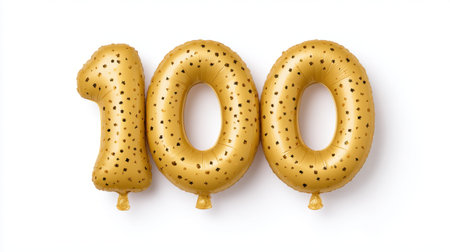This vibrant image showcases golden foil balloons in the shape of the number one hundred, decorated with black confetti. Ideal for milestone celebrations.の素材