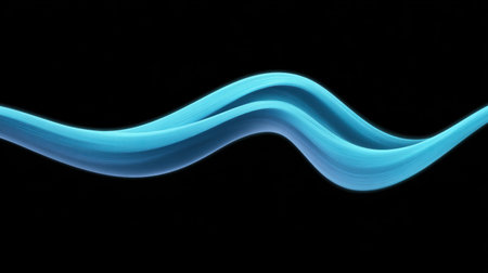 A captivating abstract image depicting smooth and fluid waves of bright blue light gracefully flowing against a deep dark background.の素材