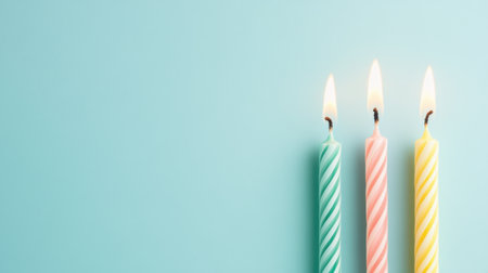 Brighten up your celebration with these colorful birthday candles in pink, blue, and yellow. Perfect for adding a cheerful touch to any festive atmosphere.の素材