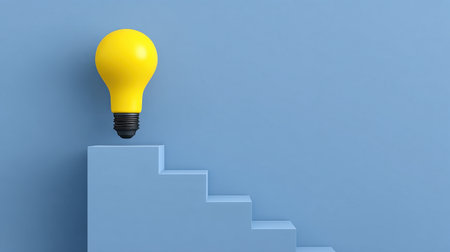 A bright yellow light bulb perched on abstract stair steps against a blue backdrop symbolizes the connection between creativity, growth, and achieving potential in business.の素材