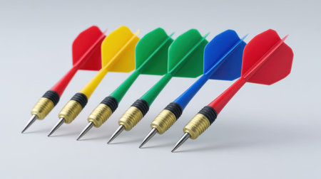 A set of vibrant and colorful darts displayed on a soft background, perfect for illustrating concepts of leisure, competition, and social gaming activities.の素材