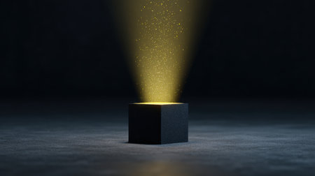 A captivating scene features a black cube in a dark space, emitting a warm light upward, creating a magical atmosphere with floating particles.の素材