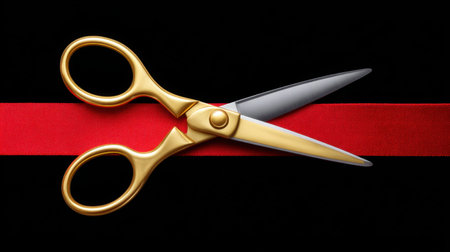A pair of elegant golden scissors poised to cut through a bright red ribbon. This dynamic image captures the essence of celebration, achievement, and significant moments.の素材