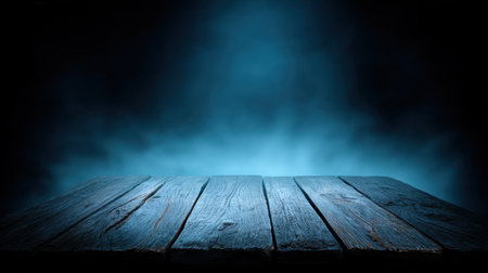 A captivating wooden plank surface illuminated by a soft blue light, surrounded by fog in a dark studio, ideal for creative product displays and atmospheric photography.の素材