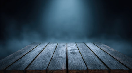 A beautifully composed image capturing a dark wooden table with dramatic lighting and fog. Ideal for use as a backdrop or in artistic photography projects.の素材