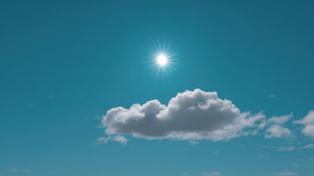 A stunning view of a vibrant blue sky with a bright sun shining above soft white clouds provides a serene and uplifting atmosphere.の素材