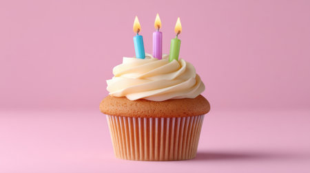 A delightful birthday cupcake featuring three lit candles and creamy frosting, perfect for celebration themes, festive events, and joyful moments.の素材