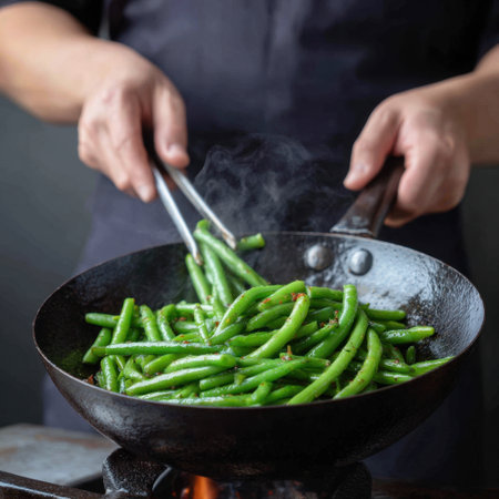 A chef expertly stir-fries fresh green beans in a wok, with vibrant colors and steam rising, capturing the essence of culinary creativity and skill.の素材
