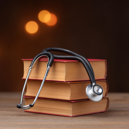 An elegant stethoscope rests atop a stack of books, surrounded by soft bokeh lighting. This image symbolizes the intersection of medicine and education, ideal for healthcare and academic themes.の素材
