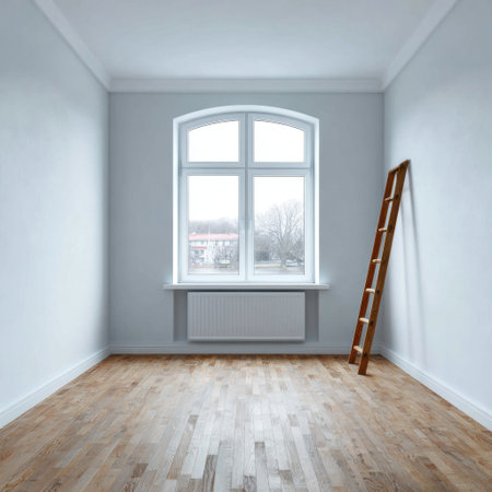 A minimalist interior space featuring white walls and a laminated wooden floor, illuminated by natural light from a large window. A wooden ladder leans against the wall, suggesting potential renovation or decoration. The room exudes tranquility and simplicity, perfect for an inviting and modern living environment.の素材
