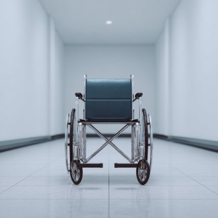 An empty wheelchair sits in a well-lit, minimalist hallway, showcasing an atmosphere of calm and accessibility in a modern healthcare facility.の素材