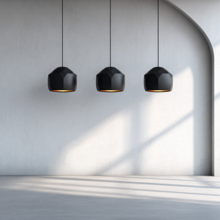 This modern interior showcases a minimalistic design with hanging black lamps illuminating an empty space, highlighting geometric shapes and soft natural light.の素材