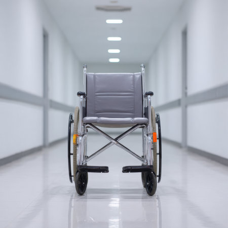 A solitary wheelchair stands in a clean, well-lit hospital corridor, representing themes of mobility, healthcare, and patient support in a modern facility.の素材