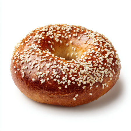 This image features a freshly baked sesame seed bagel with a golden-brown crust, perfect for breakfast or a savory snack. Ideal for culinary use.の素材