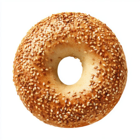 This image features a freshly baked sesame bagel, showcasing its golden brown crust and unique texture, ideal for culinary presentations and food-related projects.の素材