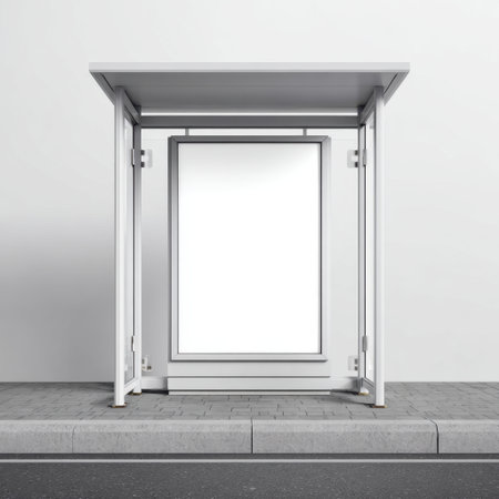 A sleek and modern empty bus stop shelter featuring blank advertising space. The minimalist design emphasizes urban simplicity in a clean outdoor environment.の素材