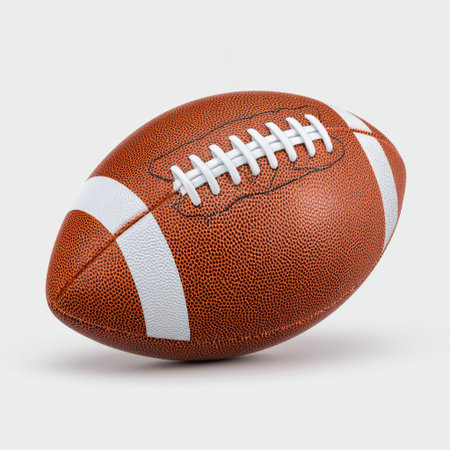 A classic brown sports football showcasing detailed stitching and design, perfect for illustrating themes of athletic competition and teamwork.の素材