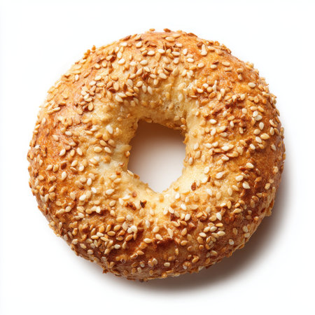 A delicious freshly baked sesame bagel featuring a golden crust and inviting texture, perfect for breakfasts, snacks, or a delightful meal option.の素材