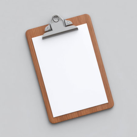 A clean and minimalistic empty clipboard with a blank white sheet against a soft gray background, ideal for mockups, presentations, and creative projects.の素材