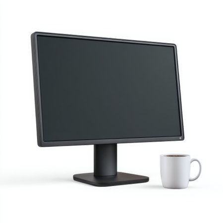 A sleek, minimalistic computer monitor stands prominently on a solid base next to a coffee mug, offering a fresh and modern workspace look.の素材