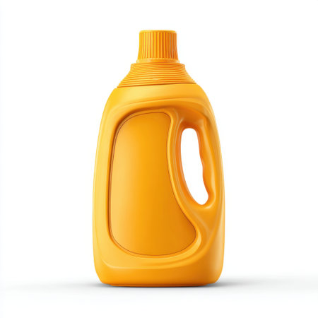 This bright yellow laundry detergent bottle stands out against a white background, representing cleanliness and hygiene for marketing purposes, ideal for brands.の素材
