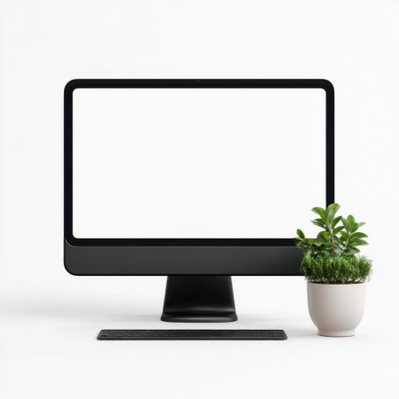 A sleek black computer monitor with a blank screen sits alongside a small potted plant, creating a tranquil workspace atmosphere in a minimalist setting.の素材