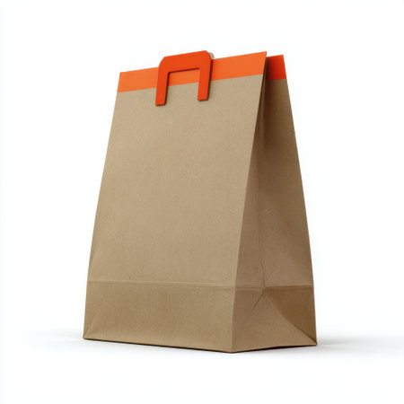 This image features a brown paper shopping bag with a bright orange handle, perfect for showcasing eco-friendly packaging and branding designs.の素材