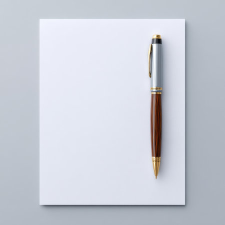 A sophisticated pen lies on a blank sheet of paper, offering a clean canvas for thoughts and ideas. Ideal for conveying creativity and professionalism.の素材