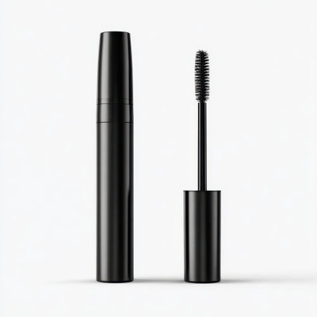 This image showcases a sleek black mascara tube alongside its wand, set against a minimalistic background, ideal for cosmetic product promotion.の素材