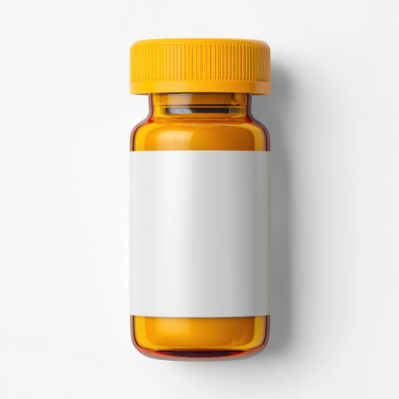 This image features an orange prescription bottle with a blank white label, situated against a clean white background. Ideal for healthcare branding, medication storage, or customization.の素材