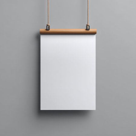 This versatile blank poster mockup features a wooden hanger against a soft gray background, ideal for showcasing designs, artwork, or advertisements.の素材
