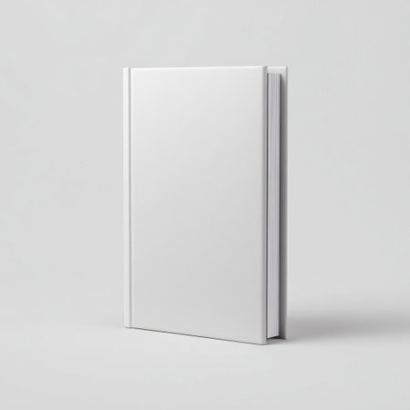 A blank white book cover rests against a soft light backdrop, showcasing a minimalistic design for customizable publishing projects or personal writing.の素材