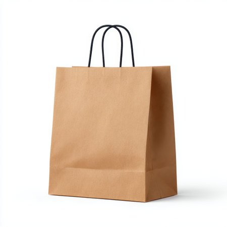 This brown paper bag with twisted handles stands out with its simple and practical design, perfect for shopping, gifting, or everyday use.の素材