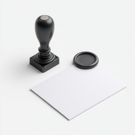 A minimalist black rubber stamp and an empty sheet of paper isolated on a white background, ideal for showcasing branding, design, or document needs.の素材