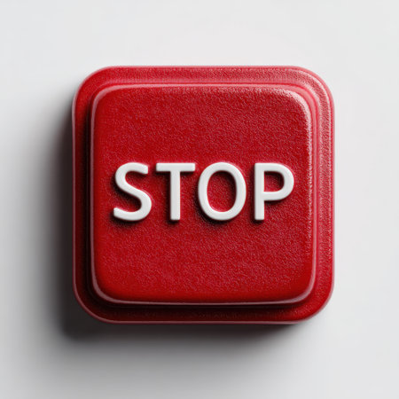 A vibrant red stop button featuring bold white letters, designed to communicate urgency and attention in various contexts. Ideal for safety themes.の素材