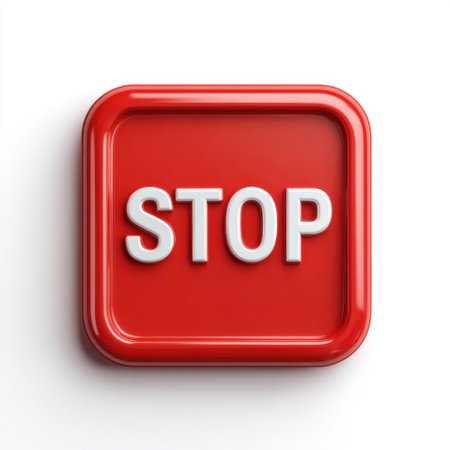 This image features a bright red stop button with bold white lettering set against a clean white surface, symbolizing traffic safety and alertness.の素材