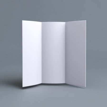 This image features a blank open brochure with clean white pages set against a smooth gray background, ideal for showcasing designs or marketing materials.の素材