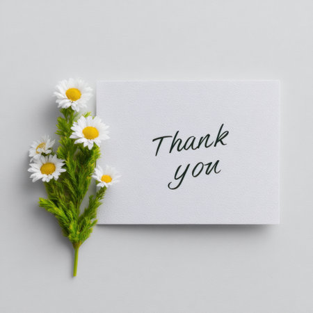 A beautiful thank you card featuring fresh daisies and a heartfelt message on a gray background, perfect for expressing gratitude and appreciation.の素材