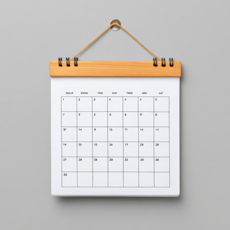 This image features a blank monthly calendar displayed against a gray background. It is attached with a wooden clip, showcasing a minimalist design perfect for planning and organized tasks.の素材