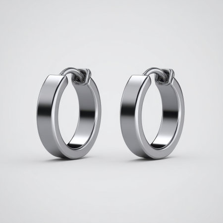 This image features elegant silver hoop earrings displayed against a minimalist background, showcasing their refined design and shine. Perfect for jewelry promotions.の素材
