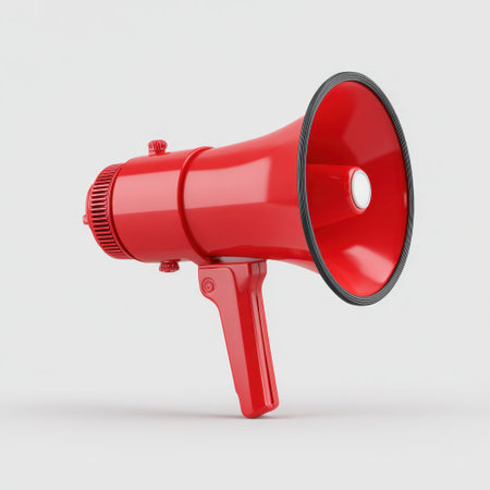 A bright red megaphone stands on a clean background, symbolizing communication, announcements, and effective outreach during events or gatherings.の素材