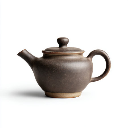 This elegant brown ceramic teapot features a stylish design with a curved handle and lid, perfect for serving warm beverages and enhancing tea times.の素材