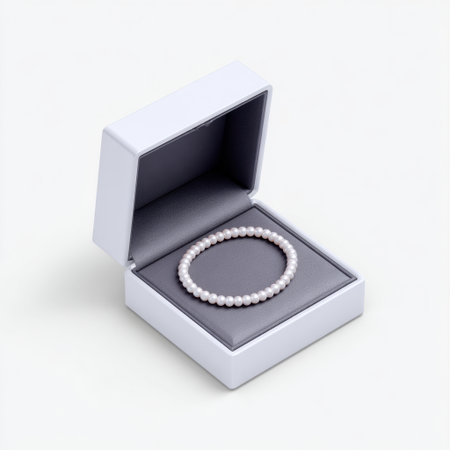 This image showcases an elegant pearl bracelet nestled in a chic white jewelry box, ideal for highlighting luxury fashion accessories or gift ideas.の素材