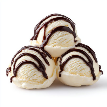A visually appealing arrangement of three scoops of vanilla ice cream, artfully drizzled with rich chocolate sauce, perfect for food lovers and dessert enthusiasts.の素材