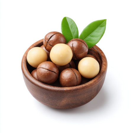 Discover a delightful arrangement of gourmet chocolate spheres resting in a rustic wooden bowl. The combination of flavors and textures makes this treat an indulgent choice for dessert lovers.の素材