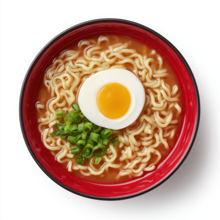 Enjoy a captivating bowl of ramen noodles topped with a soft boiled egg and fresh green onions, perfect for a quick and satisfying meal.の素材